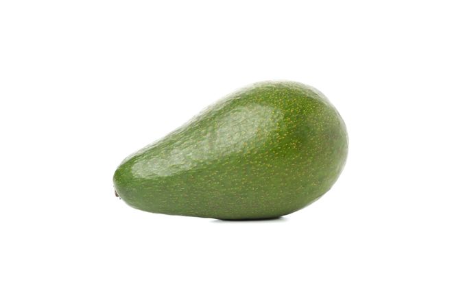 Ripe fresh avocado isolated on plain background