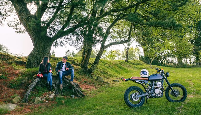 Couple resting from a motorcycle trip