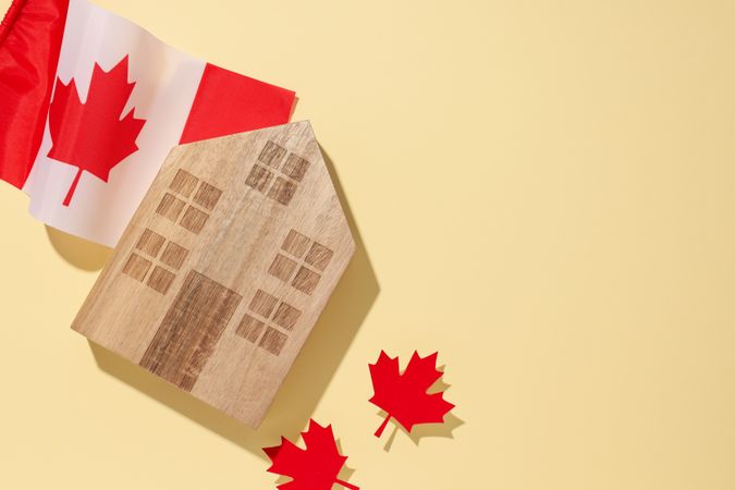 A wooden house with the flag of Canada
