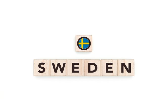 Wooden blocks bearing the name and flag of Sweden.