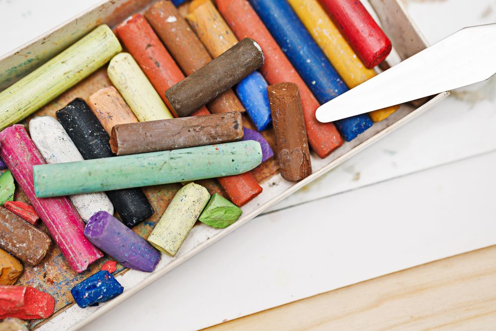 Box of colorful pastel crayons