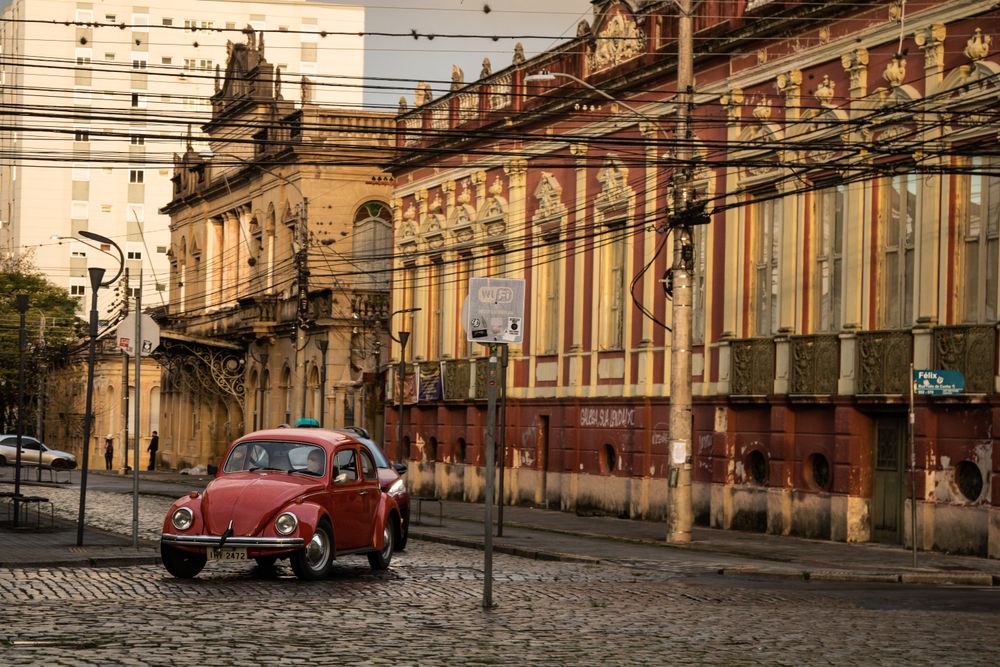 Red beetle car on the road in Pelotas, Rio Grande do Sul, Brazil