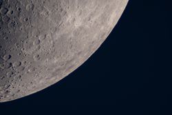 Close-up of lunar craters near the moon's southern hemisphere.