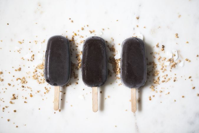 Three chocolate popsicles