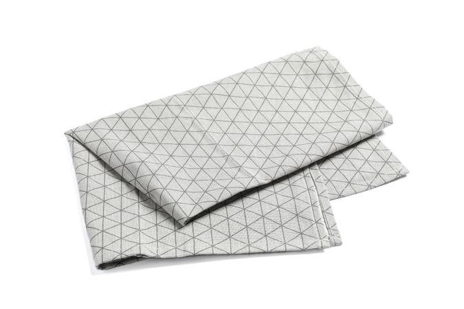 Folded grey napkin isolated on blank background