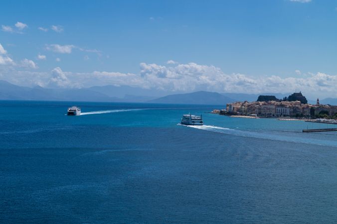 Boats on blue sea under blue sky