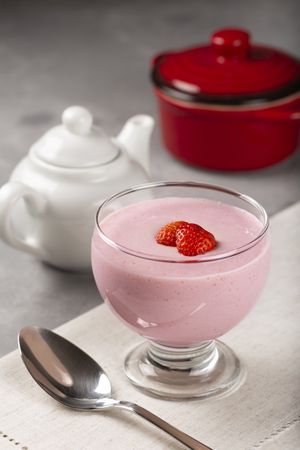 Delicious strawberry mousse in glass goblet.
