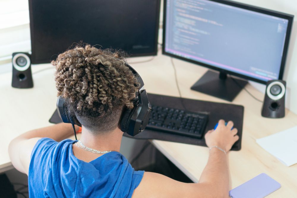Male programmer working at his desk at home