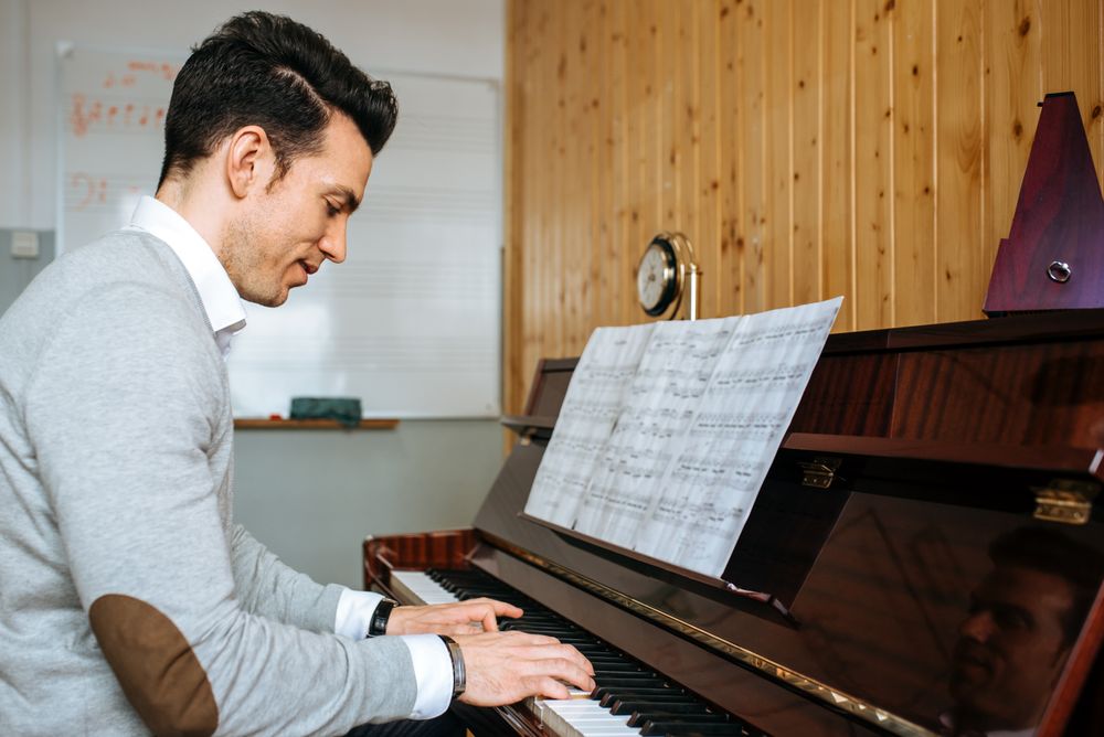 Man playing piano in studio