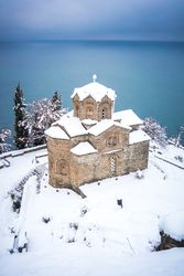 Old Orthodox church on lake coast