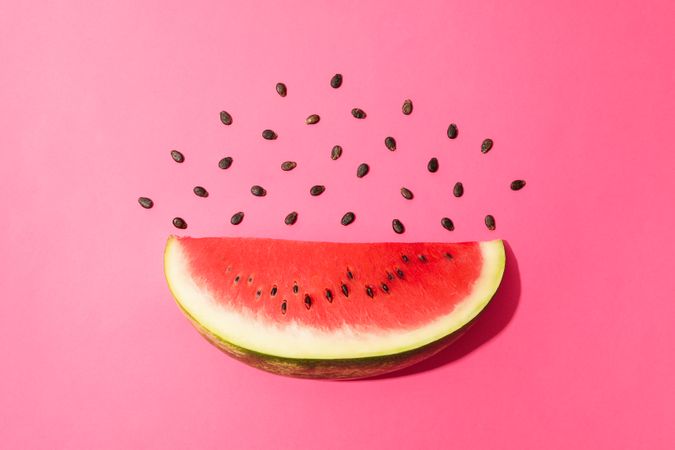 Composition with watermelon slice on pink background. Summer fruit