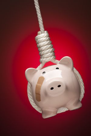 Piggy Bank with Bandage Hanging in Hangman's Noose on Red