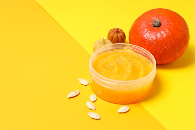 Skin care and face care concept - pumpkin cosmetic