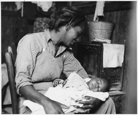 Migrant African-American cotton picker and her baby, photo by Dorothea Lange