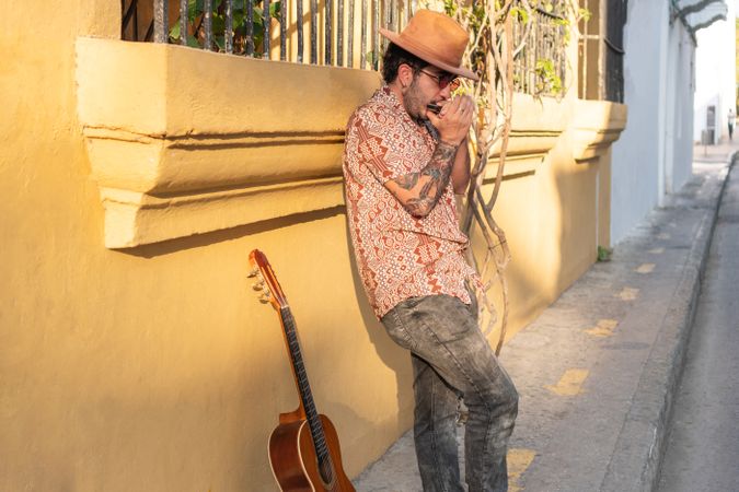 Young Man Playing Music On The City Streets