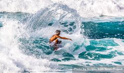 Man surfing on sea waves during daytime 0KQQ74
