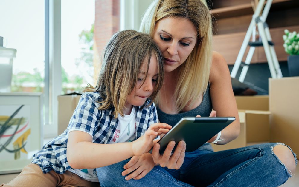Mother and son playing the tablet