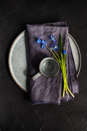 Top view of table setting with blue scilla siberica