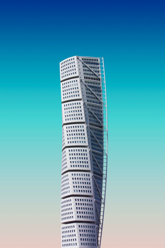 Spiral skyscraper under blue sky