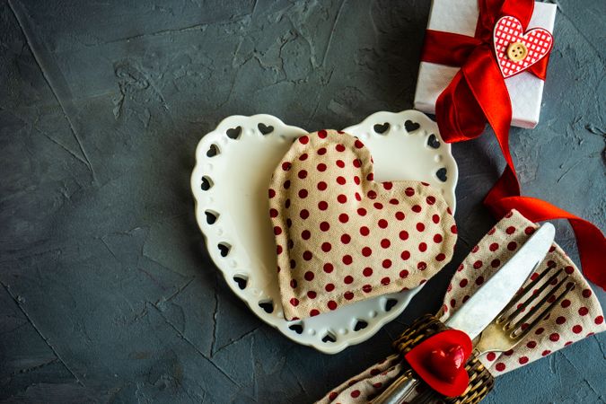 St. Valentine day table setting with dotted napkin and felt heart
