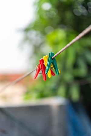 Colorful clothespins hanging on a clothesline