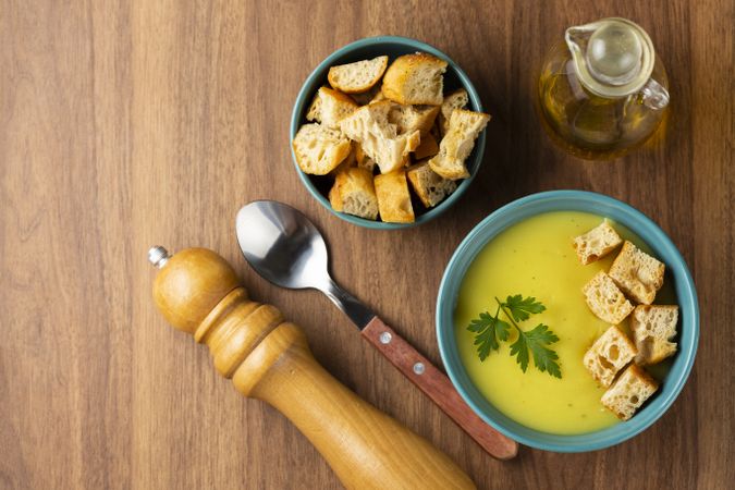 Bowl with onion soup and croutons on the table.