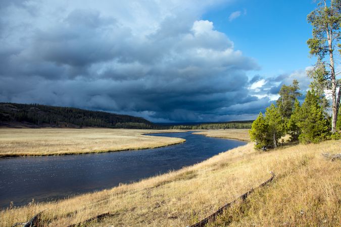 Storm clouds above the Firehole River in Yellowstone National Park in Wyoming