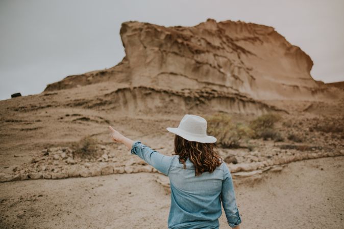 Female tourist walking on sandy quarry