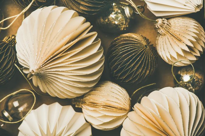 Gold and cream folded tree ornaments, and baubles, close up