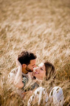 Serene lovers embracing on wheat field