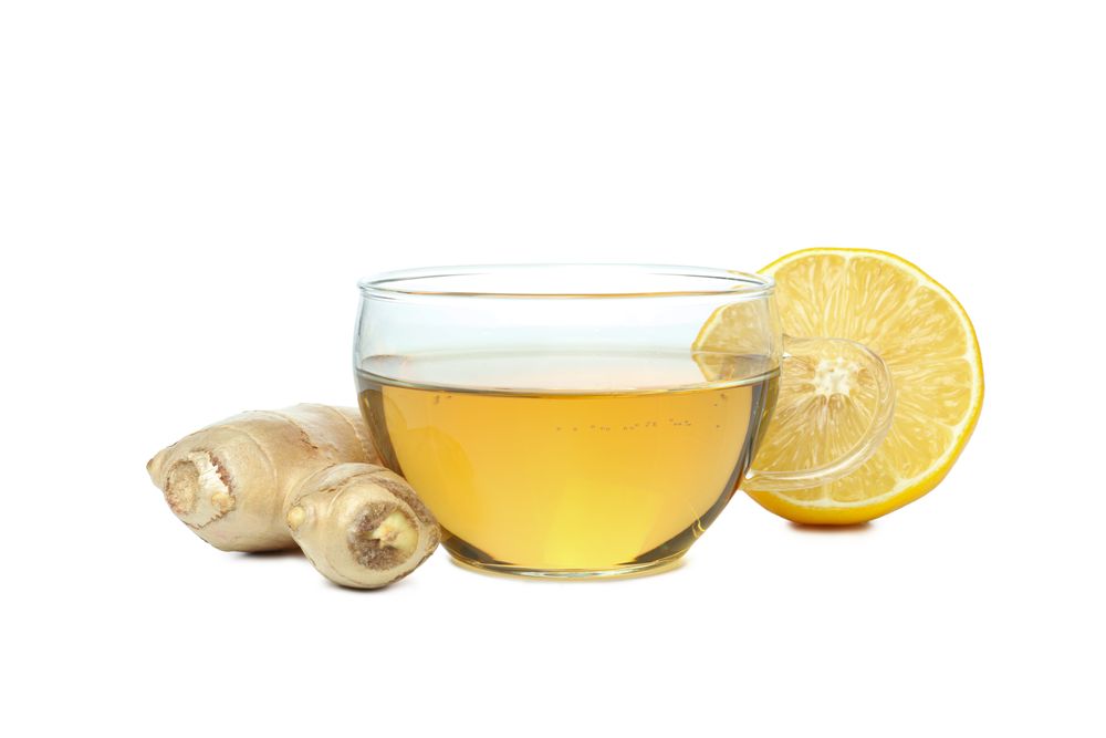 Cup of tea, lemon and ginger, isolated on plain background