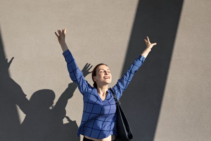 Excited businesswoman jumping