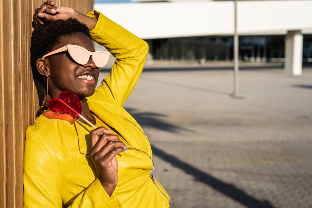 Black woman eating candy