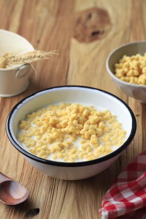 Bowl of Star Shaped Cereal Honey Star with Fresh Milk for Breakfast.