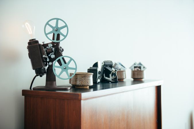 Vintage film cameras on top of bookshelf