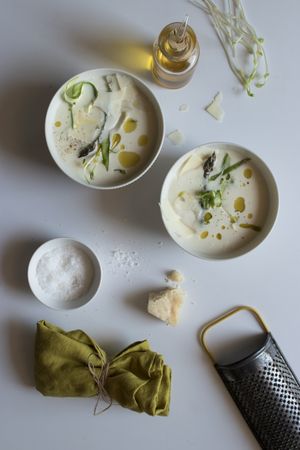 Kitchenware and condiments near asparagus cream soup
