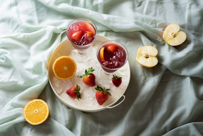 Sangria glass on a tray with fresh fruits