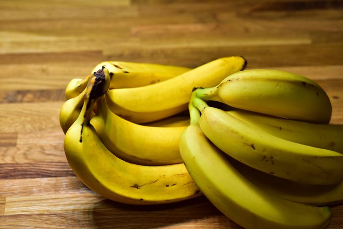 Yellow banana on a wooden table.