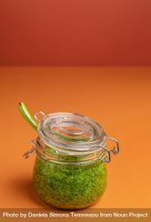 Green pesto sauce in a glass jar bEV3M0