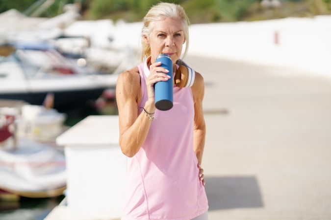Mature female drinking between  exercise