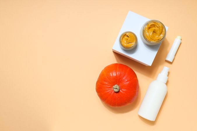 Skin care and face care concept - pumpkin cosmetic