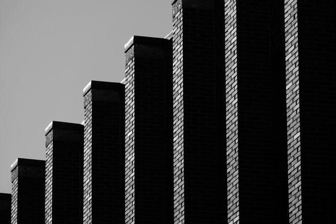 Grayscale photo of identical buildings