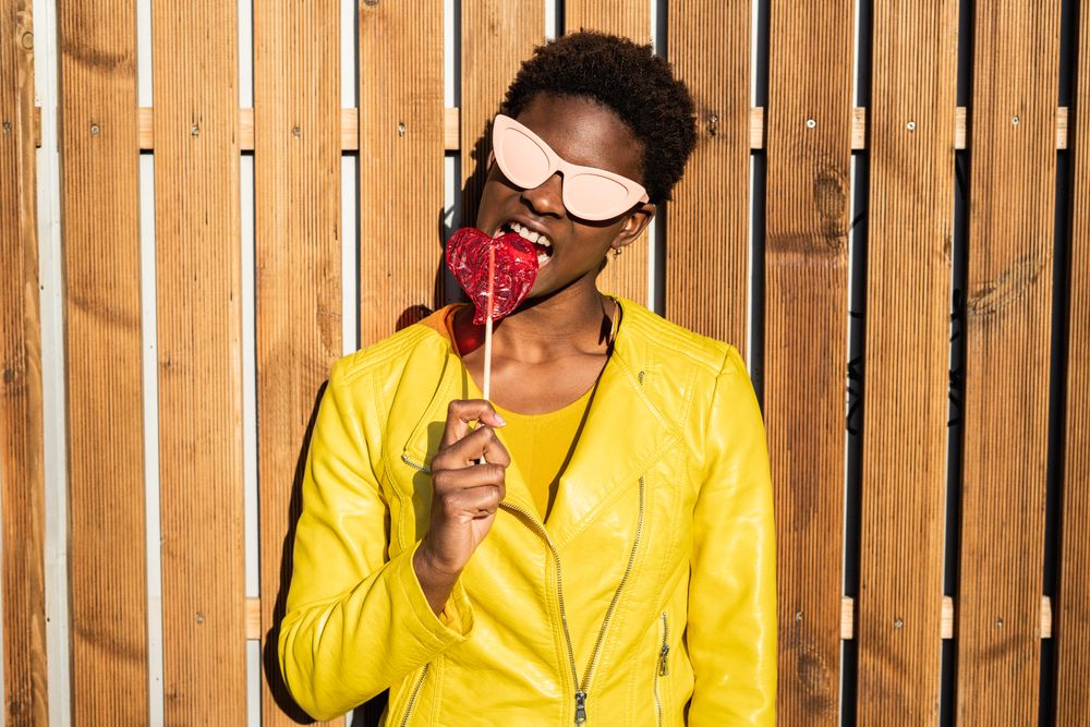 Black woman eating candy