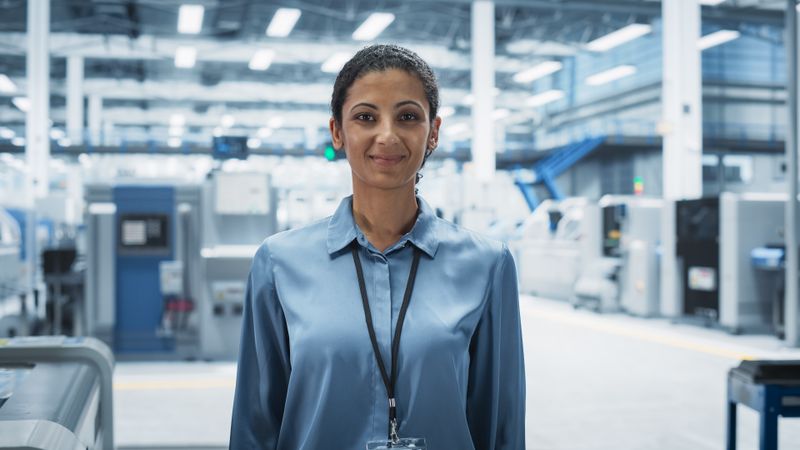 Portrait of proud female scientist in lab