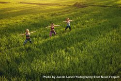 Three young women exercising in farm bxL3Zb