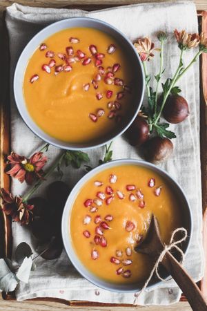 Served bowls of delicious pumpkin soup