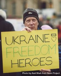 London, England, United Kingdom - March 5 2022: Man holding yellow sign in support of Ukraine bDKoE4