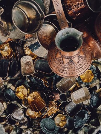 Top view of Turkish coffee pot and small jewelry boxes