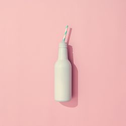 Painted drink on pastel pink background
