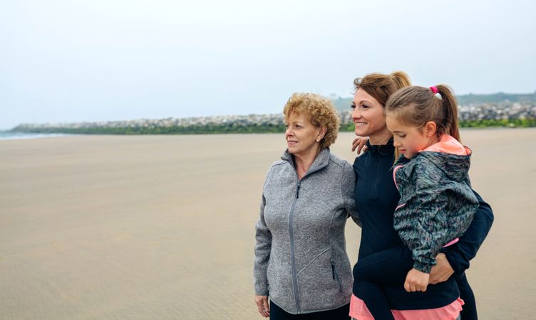 Three generations looking at sea